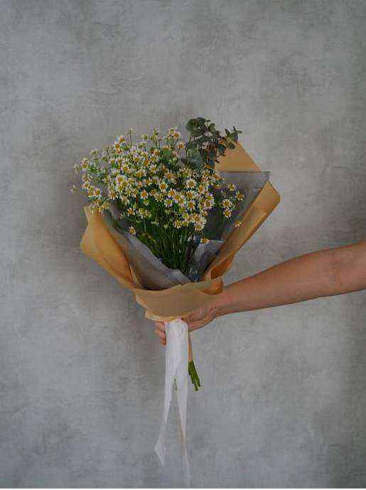 Bridesmaid holding bouquet